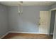 Bedroom featuring a door, grey walls, and wood floors at 2172 Jernigan Drive Se, Atlanta, GA 30315