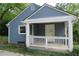 A quaint, single-story home featuring blue siding and a welcoming covered porch with white railing at 2172 Jernigan Drive Se, Atlanta, GA 30315