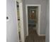 Hallway connecting to another room or area of the house with wood flooring and grey paint at 2172 Jernigan Drive Se, Atlanta, GA 30315