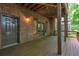Covered back patio with a door leading inside, perfect for entertaining at 2664 Long Pointe, Johns Creek, GA 30076