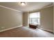 Bedroom featuring plush carpet, a large window, and classic trim at 2664 Long Pointe, Johns Creek, GA 30076