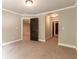 Bedroom with archway leading to another room, carpet flooring, and neutral walls at 2664 Long Pointe, Johns Creek, GA 30076