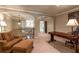 Bonus room area with comfortable seating, desk, and plenty of natural light at 2664 Long Pointe, Johns Creek, GA 30076