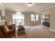 Bonus room with oversized windows and two seating areas, perfect for entertaining or relaxing at 2664 Long Pointe, Johns Creek, GA 30076