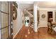 Inviting entryway with hardwood floors, staircase, and views into the dining room and living spaces at 2664 Long Pointe, Johns Creek, GA 30076
