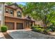 Charming two-story home with brick and siding exterior, attached two-car garage, and professionally landscaped front yard at 2664 Long Pointe, Johns Creek, GA 30076