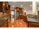 Gourmet kitchen with custom cabinets, granite countertops, stainless steel appliances and designer backsplash at 2664 Long Pointe, Johns Creek, GA 30076