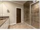 Well-appointed bathroom with a double vanity, glass-enclosed shower, and modern fixtures for a luxurious feel at 2664 Long Pointe, Johns Creek, GA 30076