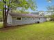 Spacious backyard featuring a lush lawn and fenced perimeter at 3428 Quail Sw Run, Marietta, GA 30008