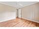 A warm bedroom featuring wood floors, a ceiling fan, and neutral colored walls at 3428 Quail Sw Run, Marietta, GA 30008