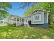 Charming single-story home boasts a inviting front porch and manicured lawn at 3428 Quail Sw Run, Marietta, GA 30008