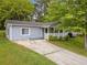 Charming single-story home with a well-maintained lawn and inviting front porch at 3428 Quail Sw Run, Marietta, GA 30008