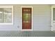 Charming wood front door with glass panes, enhancing curb appeal at 3428 Quail Sw Run, Marietta, GA 30008