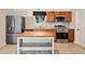 Charming kitchen with stainless steel appliances, custom cabinets, and tiled floor at 3428 Quail Sw Run, Marietta, GA 30008