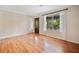 Bright living room with wood floors and natural light, featuring a decorative entry door at 3428 Quail Sw Run, Marietta, GA 30008