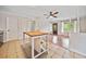 Open living space with kitchen island, hardwood, and an inviting entrance at 3428 Quail Sw Run, Marietta, GA 30008