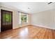 Inviting living room featuring hardwood floors and a bright, sunlit window at 3428 Quail Sw Run, Marietta, GA 30008