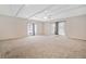 Large living room with carpet, two windows, and white trim at 3428 Quail Sw Run, Marietta, GA 30008