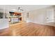 Open living space with hardwood floors and a partial view of the updated kitchen at 3428 Quail Sw Run, Marietta, GA 30008