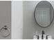 Modern bathroom with a sleek mirror, stylish sink, and neutral color palette at 1000 Admiral Xing, Alpharetta, GA 30005