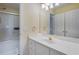 Bright bathroom with a shower and tub combo, long vanity, and neutral tones at 1000 Admiral Xing, Alpharetta, GA 30005