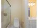 Cozy bathroom featuring shower, toilet, and sink with storage at 1000 Admiral Xing, Alpharetta, GA 30005