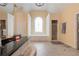 Large bathroom with a black countertop, white cabinetry, a soaking tub and a separate glass shower at 1000 Admiral Xing, Alpharetta, GA 30005