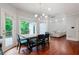 Inviting dining area with natural light and a modern light fixture at 1000 Admiral Xing, Alpharetta, GA 30005
