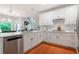 Bright, updated kitchen with white cabinets, stainless steel appliances, and modern countertops at 1000 Admiral Xing, Alpharetta, GA 30005