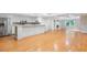 Spacious living room and bar area with stainless appliances, ample bar seating and adjacent living area at 1000 Admiral Xing, Alpharetta, GA 30005