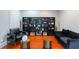 Cozy living room with stylish decor, dark bookshelves and comfortable seating at 1000 Admiral Xing, Alpharetta, GA 30005