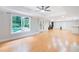 Large living room with recessed lighting, hardwood floors, a view of the pool, and access to the backyard at 1000 Admiral Xing, Alpharetta, GA 30005