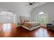 Bright main bedroom with a vaulted ceiling, sitting area, large windows and beautiful hardwood flooring at 1000 Admiral Xing, Alpharetta, GA 30005