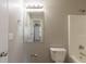 Bathroom featuring a shower-tub combo, toilet, sink with vanity, and a mirror at 1013 Odelle Cir, Mcdonough, GA 30253