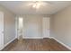 Spacious bedroom with hardwood floors and multiple doors, ready for personalization at 1013 Odelle Cir, Mcdonough, GA 30253