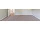 Carpeted bedroom with neutral walls and an open door at 1013 Odelle Cir, Mcdonough, GA 30253