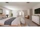 Spacious bedroom with natural light and vaulted ceiling, complete with cozy decor and a modern dresser at 1013 Odelle Cir, Mcdonough, GA 30253