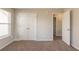 Bedroom with large closet, neutral walls, and carpet at 1013 Odelle Cir, Mcdonough, GA 30253