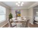 Bright dining room featuring stylish decor, wood floors, and a comfortable seating arrangement at 1013 Odelle Cir, Mcdonough, GA 30253