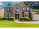 Traditional two-story brick home featuring a manicured lawn and a classic front door design at 1013 Odelle Cir, Mcdonough, GA 30253