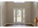 Welcoming foyer with a stylish front door and ample natural light, enhanced by hardwood floors at 1013 Odelle Cir, Mcdonough, GA 30253