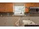 Close-up of a kitchen area awaiting renovation, showcasing fixtures and cabinet details at 1013 Odelle Cir, Mcdonough, GA 30253
