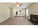 Open-concept living room featuring wood flooring and fireplace at 1013 Odelle Cir, Mcdonough, GA 30253