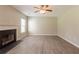 Large living room with fireplace and ceiling fan at 1013 Odelle Cir, Mcdonough, GA 30253