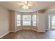 Cozy living room featuring hardwood floors and a bay window, perfect for relaxation at 1013 Odelle Cir, Mcdonough, GA 30253