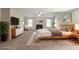 Spacious main bedroom with seating area, fireplace, and modern decor at 1013 Odelle Cir, Mcdonough, GA 30253