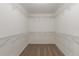 White closet with metal shelving and tan carpet at 1013 Odelle Cir, Mcdonough, GA 30253