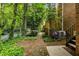 A lush backyard with green foliage and brick walkway, creating a private retreat at 1105 Clairemont Ave # O, Decatur, GA 30030