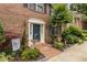 Charming brick front entrance with a blue door and well-manicured landscaping at 1105 Clairemont Ave # O, Decatur, GA 30030