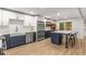 Large, updated kitchen with stainless appliances, white cabinets, large island, and a farmhouse sink at 1105 Clairemont Ave # O, Decatur, GA 30030